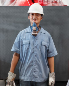 portrait-of-male-spray-painting-worker-in-crane-fa-EGM9T3X.jpg